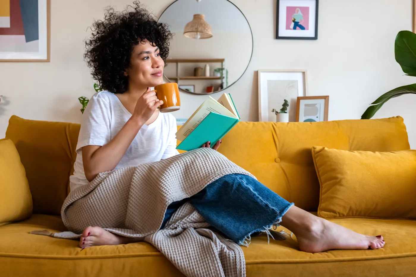 Curled up on the sofa with a book and a warm cup on a slow afternoon